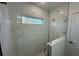 Stylish shower with glass surround and marble-look tile and window at 29 W 17Th St, Apopka, FL 32703