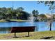 Relaxing bench overlooking a peaceful lake at 1707 Terra Cota Ct, Orlando, FL 32825