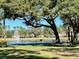 Scenic lakefront area with picnic tables and grill at 1707 Terra Cota Ct, Orlando, FL 32825