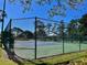 Well-maintained tennis court with surrounding fence at 1707 Terra Cota Ct, Orlando, FL 32825