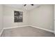 Simple bedroom with carpeted floor and window at 2472 Temple Grove Ln, Kissimmee, FL 34741