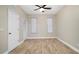 Bright bedroom with wood-look floors and ceiling fan at 2472 Temple Grove Ln, Kissimmee, FL 34741