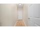 Simple hallway with light walls and tile floors at 2472 Temple Grove Ln, Kissimmee, FL 34741