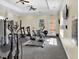 Well-equipped fitness center with exercise machines and a view of the outdoors at 1301 Tuscan Ter # 9303, Davenport, FL 33896