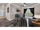 Inviting living room with a ceiling fan and a sliding glass door to the balcony at 1301 Tuscan Ter # 9303, Davenport, FL 33896