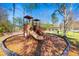 Community playground area featuring a slide, climbing structures, and a picnic area at 1301 Tuscan Ter # 9303, Davenport, FL 33896