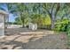 Large backyard with storage shed and mature trees at 1410 Yates St, Orlando, FL 32804