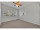 Bedroom with carpet, ceiling fan, and window shutters at 1410 Yates St, Orlando, FL 32804