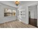 Bright dining area with built-in shelving and wood-look tile floor at 1410 Yates St, Orlando, FL 32804