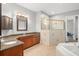 Primary bathroom with double vanity and granite countertop at 2526 Nobleman Ct, Windermere, FL 34786