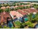Aerial view showing house and community pool at 5431 Solterra Cir, Davenport, FL 33837