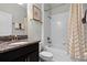 Small bathroom with a shower/tub combo and granite vanity at 5431 Solterra Cir, Davenport, FL 33837