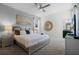Bedroom with a king-size bed and a large mirror at 5431 Solterra Cir, Davenport, FL 33837