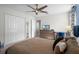 Bedroom with a queen-size bed, TV, and plenty of closet space at 5431 Solterra Cir, Davenport, FL 33837