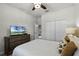 Bedroom with a queen-size bed and built-in dresser at 5431 Solterra Cir, Davenport, FL 33837