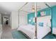 King-size bed in spacious bedroom with teal walls and ensuite bathroom at 5431 Solterra Cir, Davenport, FL 33837