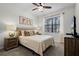 Cozy bedroom with a queen-size bed and Mickey Mouse artwork at 5431 Solterra Cir, Davenport, FL 33837