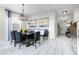 Formal dining room with modern table and chairs at 5431 Solterra Cir, Davenport, FL 33837