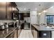 Modern kitchen with stainless steel appliances and an eat-in island at 5431 Solterra Cir, Davenport, FL 33837