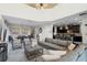 Open living space with sectional sofa, dining area, and kitchen views at 5431 Solterra Cir, Davenport, FL 33837