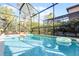 Relaxing screened pool and spa with floating devices at 5431 Solterra Cir, Davenport, FL 33837