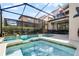 Inviting pool and spa area with screened enclosure at 5431 Solterra Cir, Davenport, FL 33837