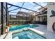 Large pool and spa with screened enclosure and comfortable seating at 5431 Solterra Cir, Davenport, FL 33837