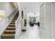 Elegant staircase leading to upper level with wall art at 5431 Solterra Cir, Davenport, FL 33837
