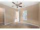 Neutral bedroom featuring carpet and a ceiling fan at 290 Silver Maple Rd, Groveland, FL 34736
