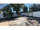 Large backyard with a pergola and concrete patio at 2906 Woodruff Dr, Orlando, FL 32837