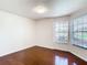 Spacious bedroom with hardwood floors and large windows at 2906 Woodruff Dr, Orlando, FL 32837