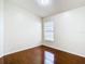 Simple bedroom with hardwood floors and a window at 2906 Woodruff Dr, Orlando, FL 32837