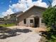 Rear view of the house, showing patio and landscaping at 2906 Woodruff Dr, Orlando, FL 32837