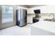 Modern kitchen with stainless steel appliances and white cabinetry at 2906 Woodruff Dr, Orlando, FL 32837