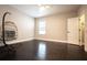 Bedroom with dark hardwood floors and a hanging chair at 790 Candlebrush Ln, Lake Mary, FL 32746