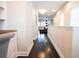 Bright hallway with dark hardwood floors, leading to living area at 790 Candlebrush Ln, Lake Mary, FL 32746