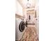 Laundry room with brick-style floor, washer, dryer, and shelving at 790 Candlebrush Ln, Lake Mary, FL 32746