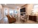 Living room featuring a brick fireplace and hardwood floors at 790 Candlebrush Ln, Lake Mary, FL 32746