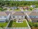 Aerial view of the backyard featuring a white fence, fire pit, and outdoor patio seating at 132 Spanish Bay Dr, Sanford, FL 32771