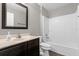 Neutral bathroom with vanity sink, mirror and tiled shower/tub at 132 Spanish Bay Dr, Sanford, FL 32771