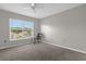 Neutral bedroom with a large window and simple furnishings at 132 Spanish Bay Dr, Sanford, FL 32771