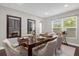 Elegant dining room featuring a large wood table and seating for six at 132 Spanish Bay Dr, Sanford, FL 32771