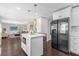 Modern kitchen featuring a white island with pendant lighting and stainless steel appliances at 132 Spanish Bay Dr, Sanford, FL 32771