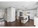 Bright kitchen with white cabinetry, island with seating, and stainless steel appliances at 132 Spanish Bay Dr, Sanford, FL 32771