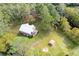 Aerial view of a home surrounded by lush greenery and a shed at 2620 Osceola Bluff Ln, Geneva, FL 32732