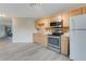 Kitchen featuring wood cabinets, stainless steel appliances, and light countertops at 2620 Osceola Bluff Ln, Geneva, FL 32732