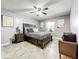 Serene bedroom with a bed, nightstand, and additional seating at 100 E Oak Terrace Dr # G1, Leesburg, FL 34748