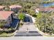 An aerial view of a gated residential community with mature trees, buildings, and lake views at 913 Lotus Vista Dr # 101, Altamonte Springs, FL 32714