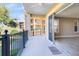 A covered balcony with a sliding glass door leading inside and an iron railing at 913 Lotus Vista Dr # 101, Altamonte Springs, FL 32714