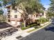 The exterior of a residential complex building with garages and mature trees at 913 Lotus Vista Dr # 101, Altamonte Springs, FL 32714